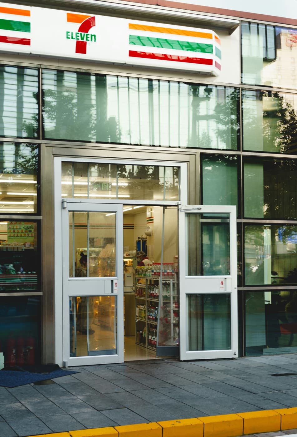 Glass store entrance doors with a shop inside